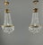 An elegant pair of bronze and cut crystal pendant lights, dating from the late 19th or early 20th century. Each light...