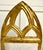 This striking set of four vintage dining chairs blends the architectural elegance of Gothic Revival design with the...