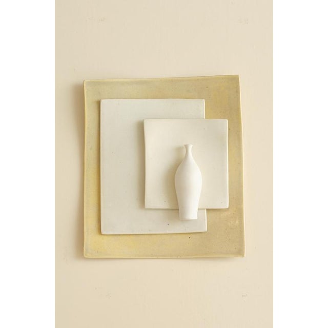 Discover the captivating ceramic wall plaque titled "Ego tripped" by Swedish designer Vivi Calissendorff. Crafted in high-...