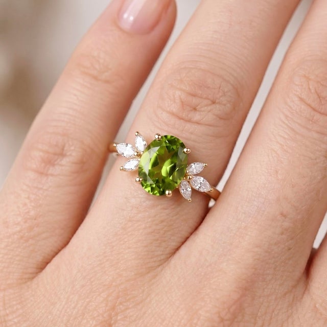 Celebrate the vibrant, sun-kissed beauty of nature with this exquisite oval peridot statement ring. At the center of this...