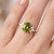 Celebrate the vibrant, sun-kissed beauty of nature with this exquisite oval peridot statement ring. At the center of this...