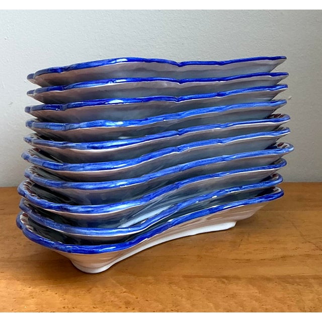 This exquisite set of ten vintage crescent-shaped salad plates is a masterwork of Italian folk art from the legendary...