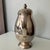 Elegant vintage silver-plated coffee pot by Empire Crafts in the Gloriana pattern. The classic pear-shaped body features a...