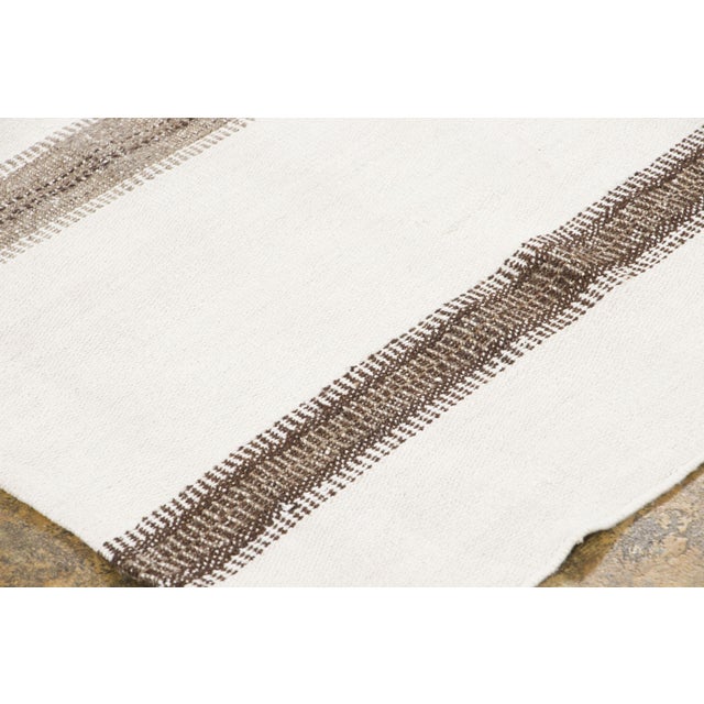 Hand-woven in pure hemp and originating circa 1950-1959, this 5x7 vintage Turkish kilim rug joins Rug & Kilim’s Kilim &...