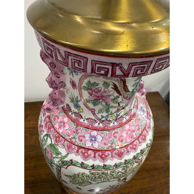 Vintage mid-to-late 20th century famille rose pink Chinese export vase lamp. Recently rewired. Two different figural...