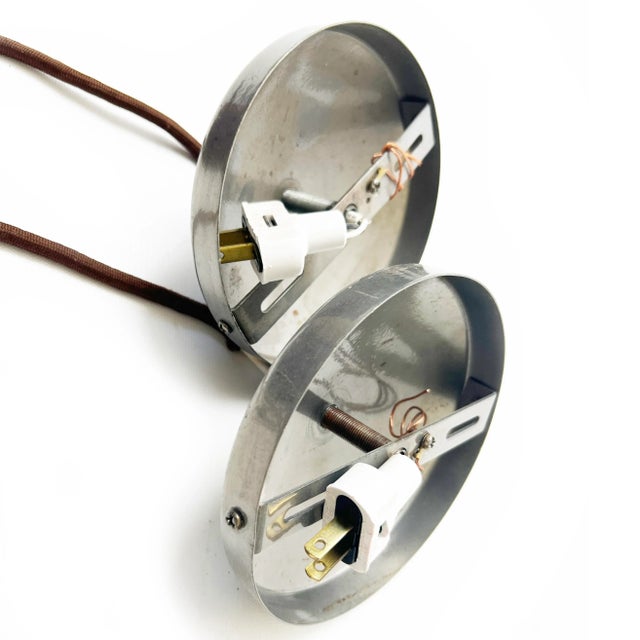 Light up your home with this pair of unique, handmade shadow art pendants. The cage bodies are made of industrial metal...