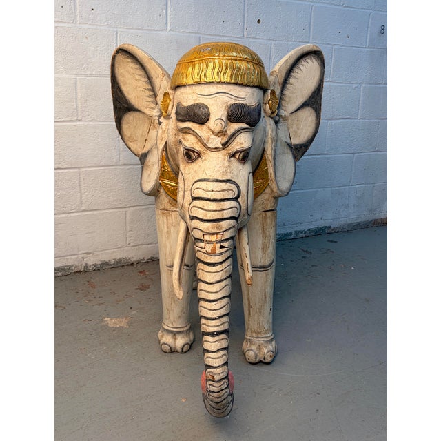 Make a bold statement with this impressive hand-carved Indian processional elephant sculpture. Expertly crafted with...