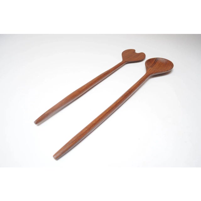 Mid-Century Modern Teakwood Salad Tongs featuring a flat fork and curved spoon server with exaggeratedly long handles (ca....
