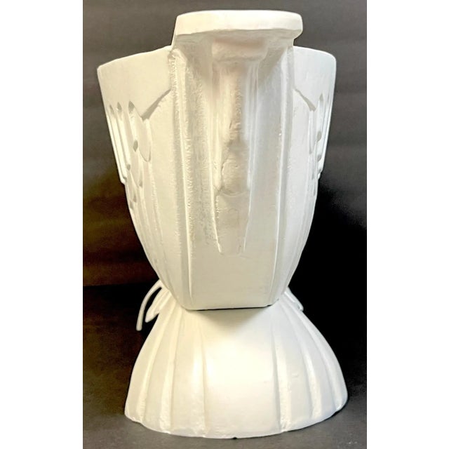 Pair of Art Deco channeled & arch design oval garden urns USA, Circa 1930s Each one of cast aluminum with continuous arch...