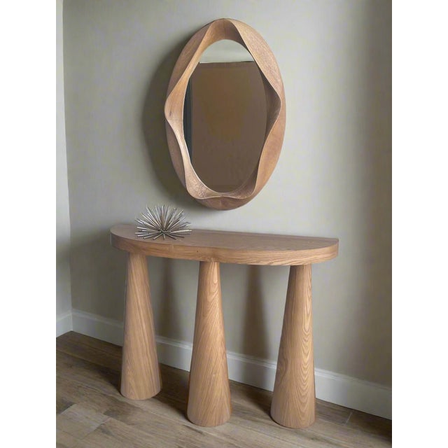 Jazz up your living space with the Cone Legs Demilune Modern Console Table and abstract mirror set. This dynamic duo...