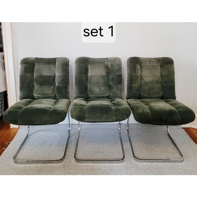 These channel-tufted moss green chairs, attributed to Roche Bobois, retain their gleaming original chrome finish. This...
