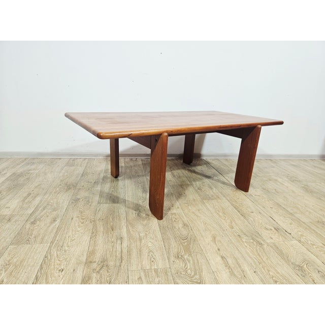 An exceptional Danish coffee table crafted from solid teak, dating back to the 1970s. The piece is characterized by a...