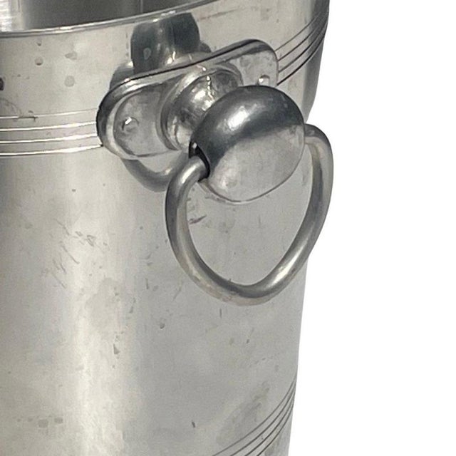 Champagne cooler or ice bucket made for Charles Heidsieck Cham. Blank metal with their logo on both sides. Handles...
