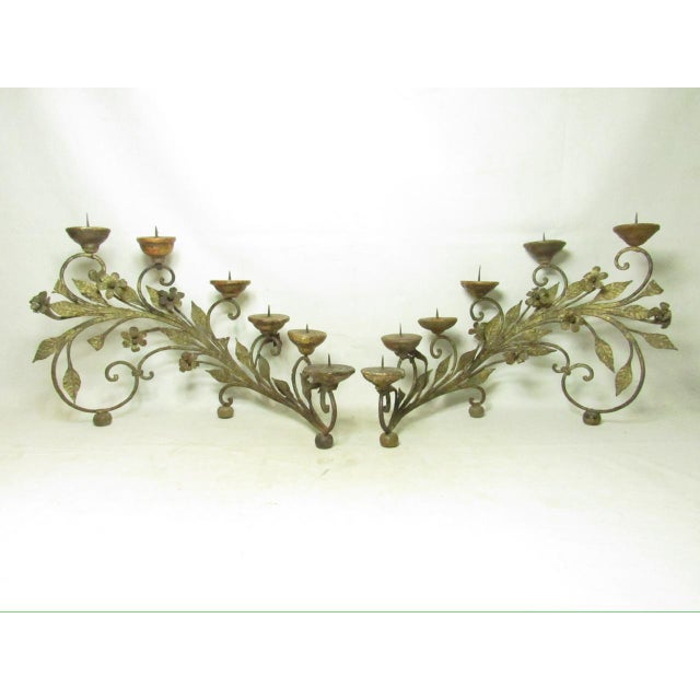 Pair of antique Italian wrought iron candelabras, c.1880 Crafted from wrought gilded iron featuring ornate scrolled floral...