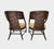 A pair of classic curved arm chairs designed by Barbara Barry for The Mcguire Company. Finish: Dark Tobacco Fabric:...