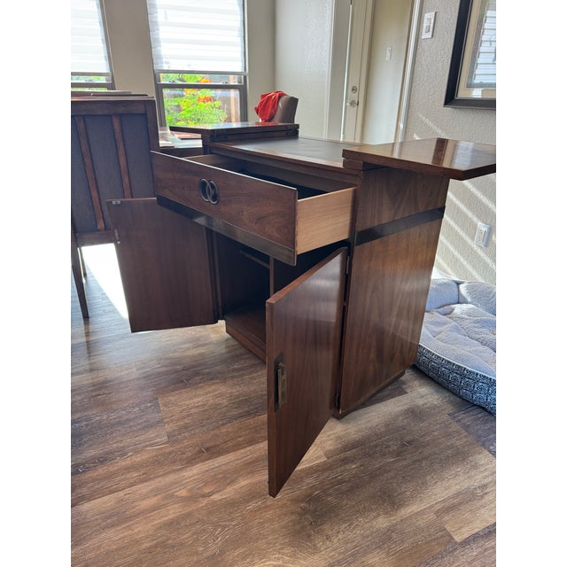 A beautiful mid-century dry bar server cabinet by the prestigious American manufacturer, Drexel Heritage. Produced during...