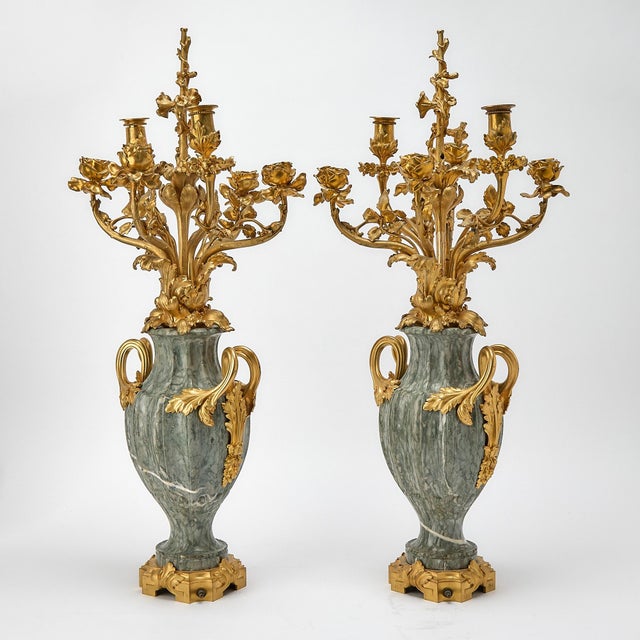 This exceptional pair of 19th-century French candelabra exemplifies the elegance and refinement of the Louis XVI...