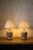 Pair of English-made table lamps from the 1970s. Ivory glazed ceramic bases with a craquelé finish, featuring a rounded...