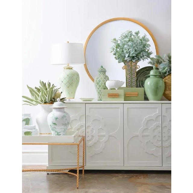 Hand decorated porcelain chinoiserie jar with removable lid and metallic gold trim