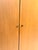 An elegant, two-door vintage wardrobe by swiss-form, likely from the 1960s. A distinctive piece of swiss mid-century...
