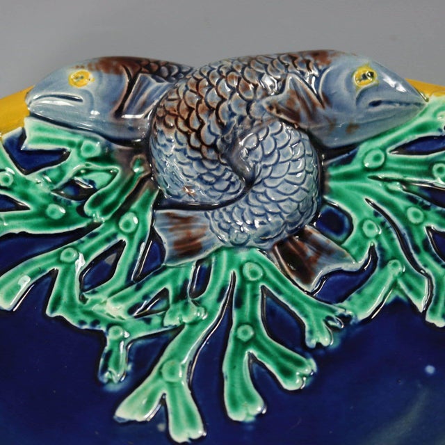 Holdcroft Majolica dish which features two entwined fish and coral. Cobalt blue ground version. Colouration: cobalt blue,...