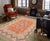 Enhance your living space with this stunning vintage Persian hand-knotted wool rug, a true showstopper that effortlessly...