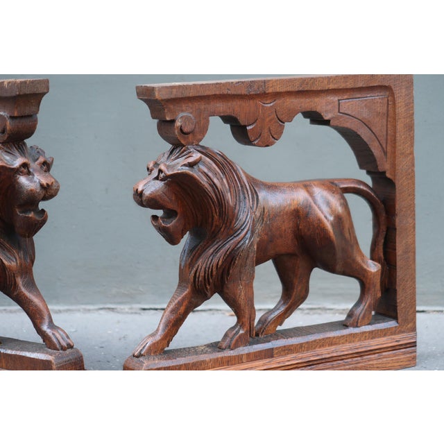 Magnificent pair of antique carved oak lions, dating most likely from the second half of the 19th century. These...