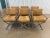 This is a stunning set of chrome and wood director's arm dining chairs. The chrome is bright and shiny. The cushions are a...