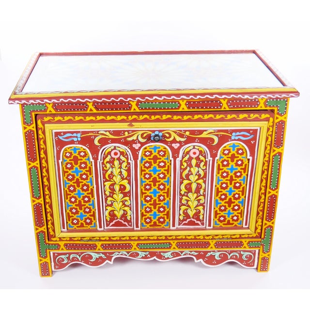 This finely hand-painted Moroccan coffee table or trunk is a striking example of North African decorative craftsmanship,...