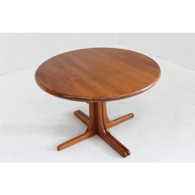 Vintage Danish round extendable dining table from the 1960s made of solid teak wood by danish furniture maker glostrup....