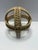 A sculptural hand-wrapped jute rope orb featuring an open lattice weave and reinforced cross-band construction. Crafted in...