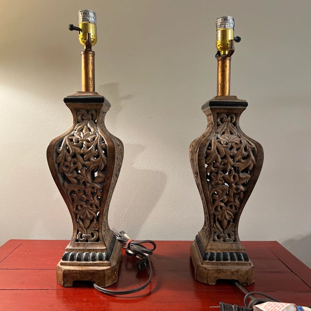 Pair of beautifully ornate, Chinese import composite filigree table lamps. Interesting shape enhances the intricate...