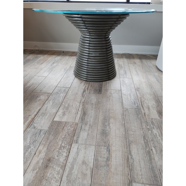 Baker's Dining Table from The McGuire Collection. Features include a Rattan Spiral Base in an "hour-glass" shape - all in...