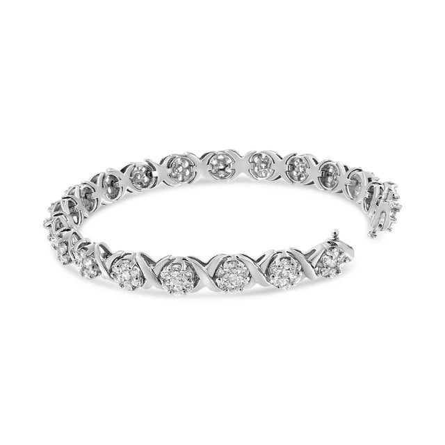 Elegant and timeless, this gorgeous 14K white gold tennis bracelet features alternating links with round clusters of...