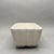 This classic mid-century ceramic planter features a beautifully ribbed, scalloped design in a clean off-white glaze....