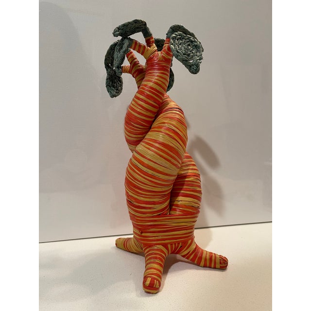 This exquisite hand-woven baobab sculpture is a masterclass in global fiber art, blending organic architectural form with...