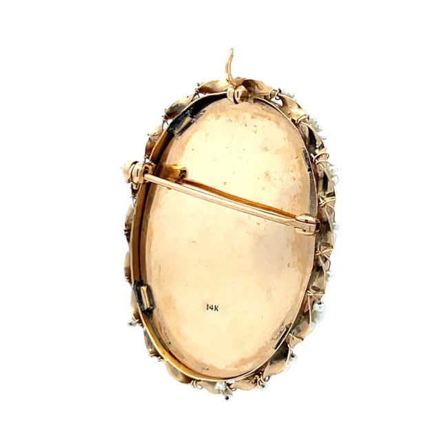 Elegant vintage convertible brooch and pendant crafted in solid 14K yellow gold, featuring a female portrait framed by a...