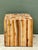 This striking vintage accent table is a masterful celebration of organic texture and geometric form. Hand-assembled from...
