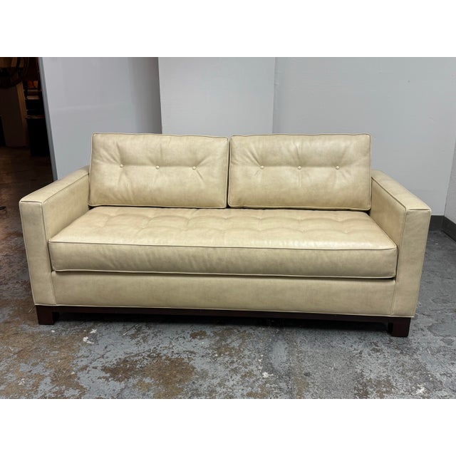 Design Plus Gallery presents a Queen Size Mid-Century Modern Vegan Leather Tufted Sleeper Sofa. This sofa has cream-toned...