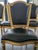 An exceptional and rare set of six authentic 19th-century French Louis XVI side chairs. These chairs feature elegantly...