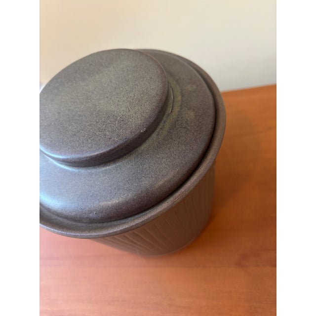 Marshall Studios ceramic canister with lid by Gordon and Jane Martz - signed on the underside. Matte brown glaze with...