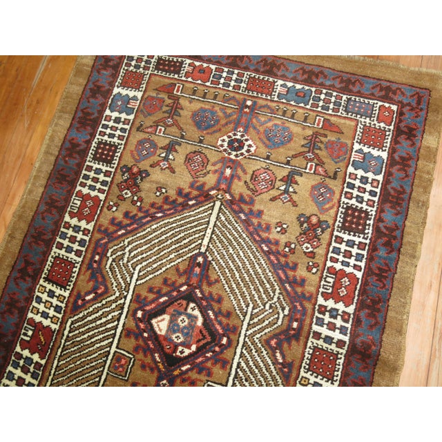 An early 20th century tribal Persian Serab runner with a geometric rustic color motif on a camel colored ground. Very...