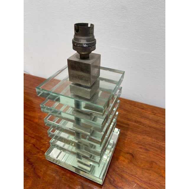 Exceptional modernist pair of table lamps by Maison Desny. It assembles 6 thick slabs of glass with nickel plated metal....