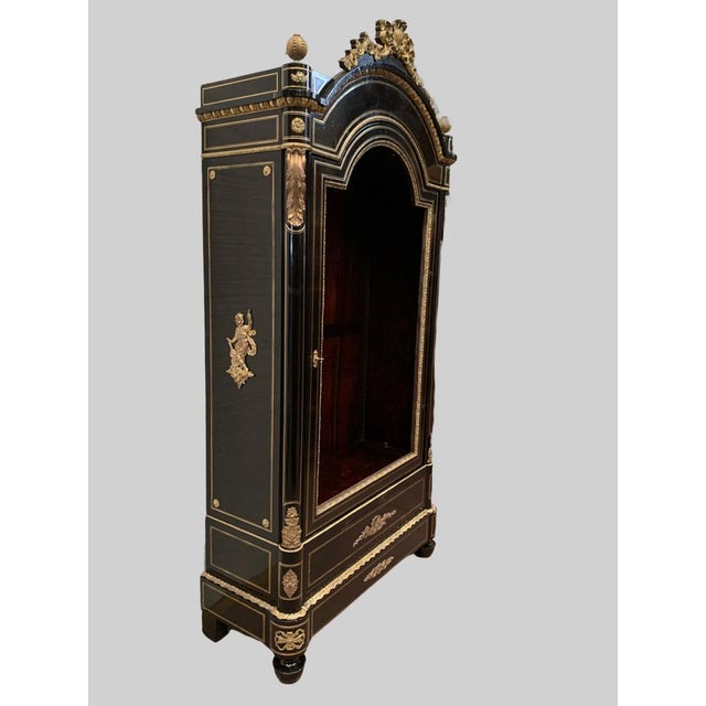 Napoleon iii ceremonial display cabinet in black wood one door with a gendarme's hat door with brass fillet inlay and...