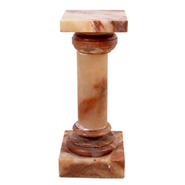 French Red Alabaster Pedestal, early 20th century, with a square revolving top, on a tapering pedestal, stepped socle and...