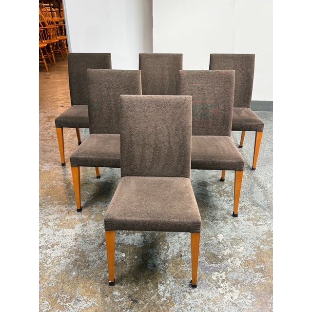 Design Plus Gallery presents a set of six Italian Modern Dining Chairs. Each chair has a tall, upholstered back and...