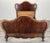 This elegant Antique French double bed frame features beautifully flowing serpentine lines and rich mahogany wood tones,...