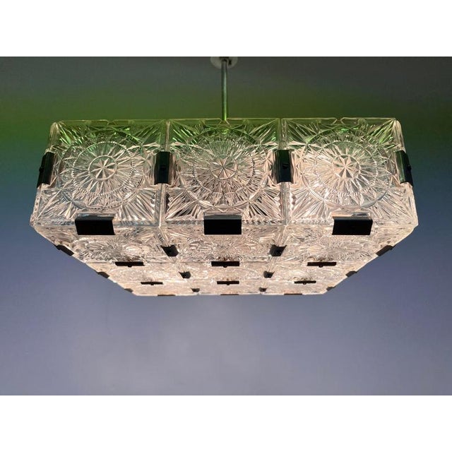 1970s pendant by Kamenicky Senov Made of chrome and glass. Good original condition. Four bulbs any wattage. US compatible....