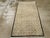 This mid-20th century Turkish Anatolian rug, measuring 3' 1" x 5' 7", presents a refined and orderly composition of...