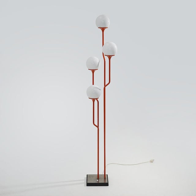 A reggiani floor lamp from the 1970s that translates the more experimental language of italian design into an essential...